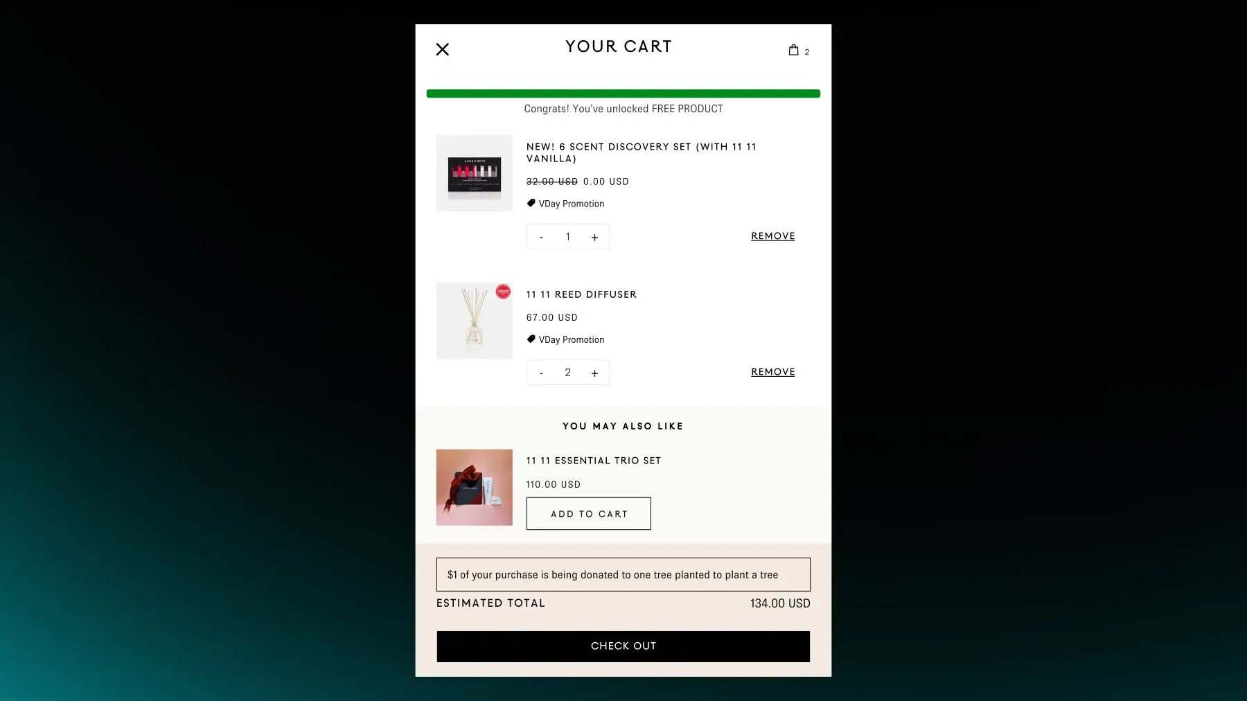 Shopify cart drawer with a gift-with-purchase promo: a progress bar unlocks a free product added to the order