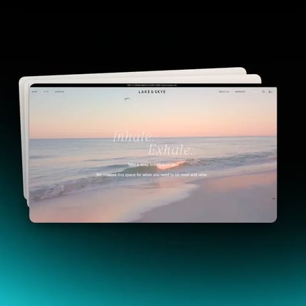 Shopify storefront hero showing a brand typography system with serif headings over a beach scene